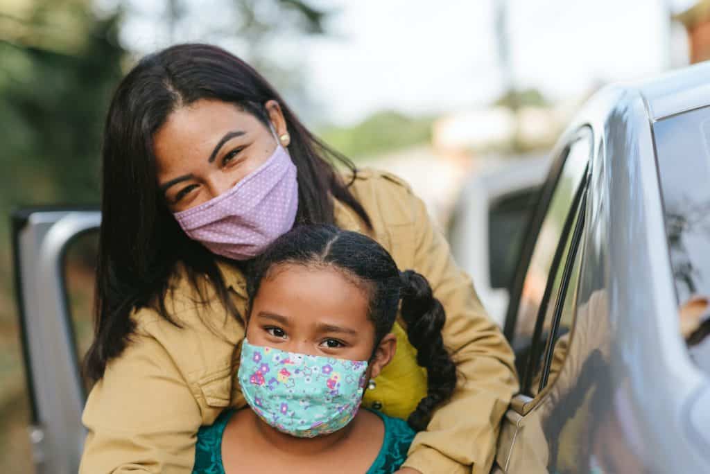 Family with masks, pandemic impacts retirement savings