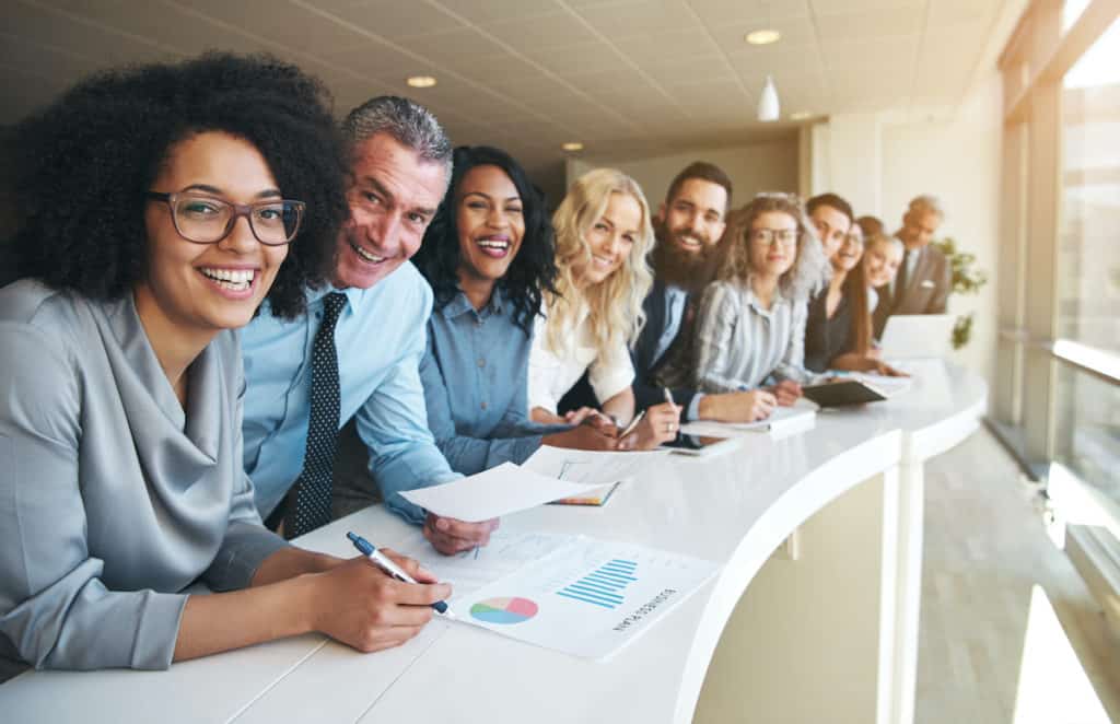 Cheerful group of colleagues in the office