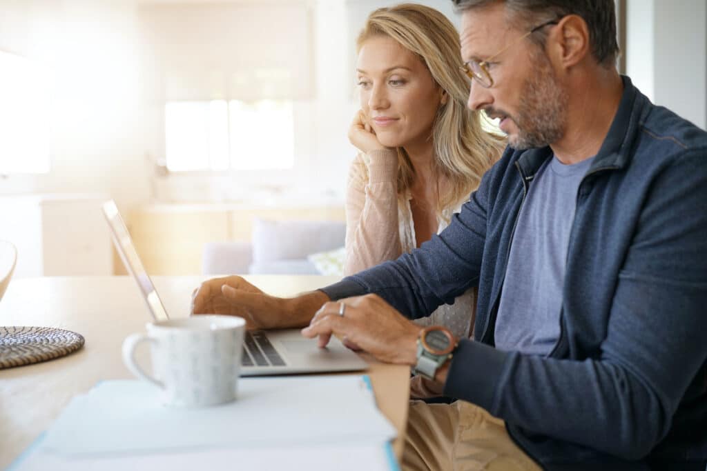 Couple looking at laptop