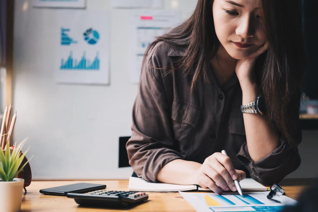 Woman analyzing employee turnover cost savings