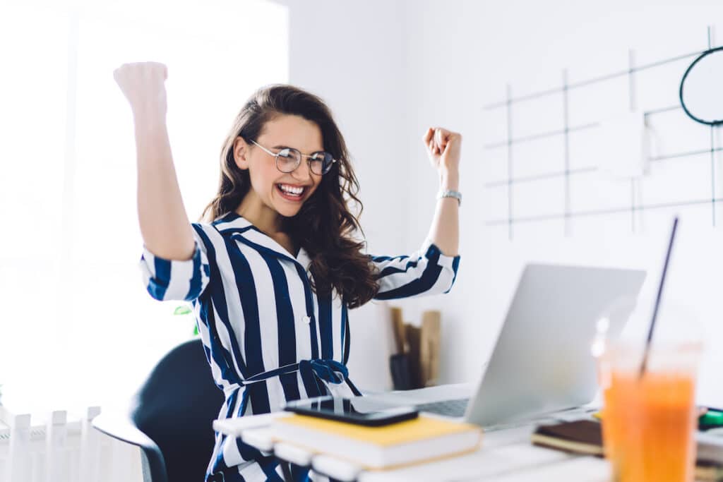 Happy worker managing her workplace retirement plan