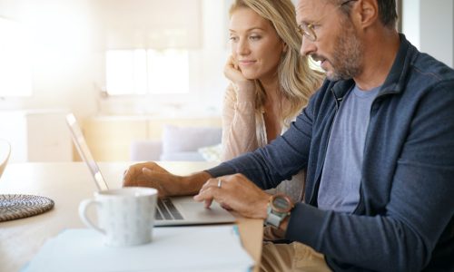Couple looking at laptop
