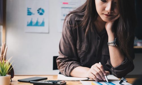 Woman analyzing employee turnover cost savings